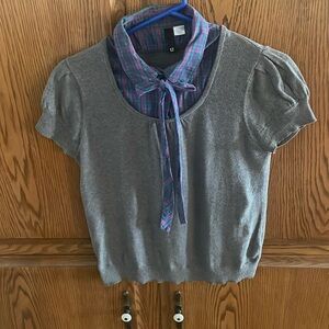 Gray sweater with green and purple plaid shirt collar and bow